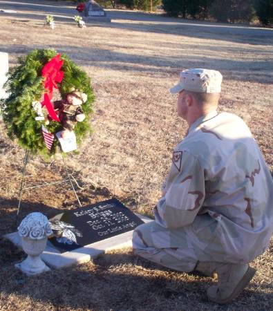 Kelsey's dad at her grave.